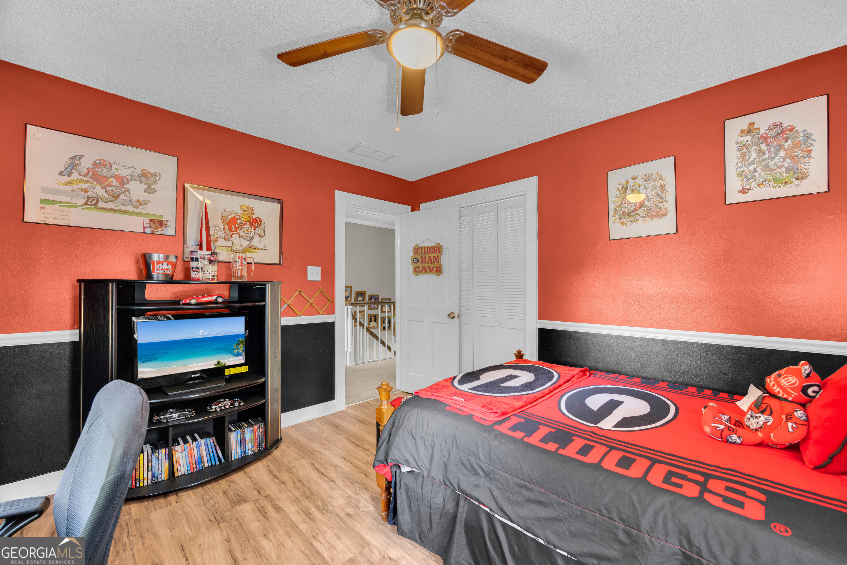1270 Airline-Goldmine Road Canon, GA 30520 - Photo 61 of 107 a bedroom with a bed a flat screen tv and a chandelier