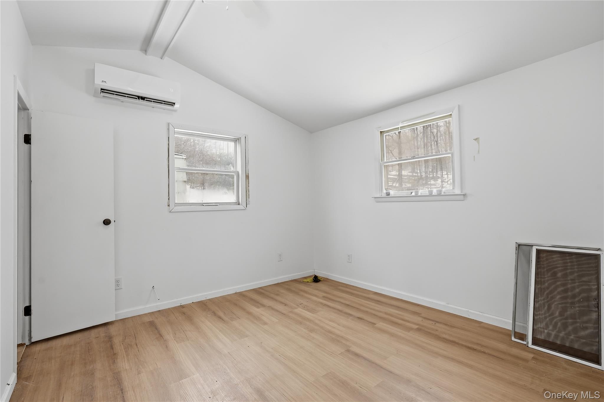 384 Tempaloni Road Ellenville, NY 12428 - Photo 12 of 18 an empty room with windows