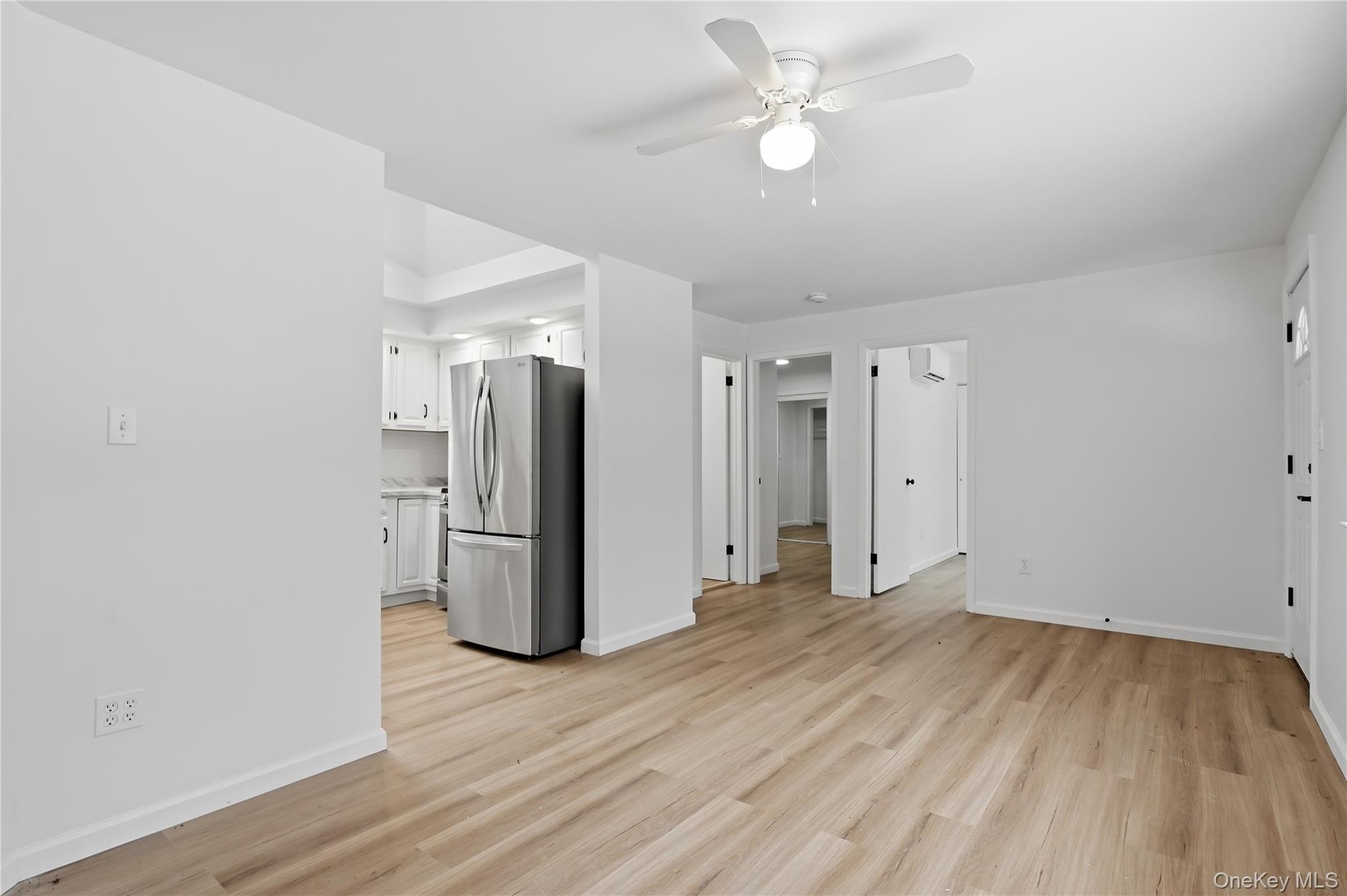 384 Tempaloni Road Ellenville, NY 12428 - Photo 4 of 18 wooden floor in an empty room with a window