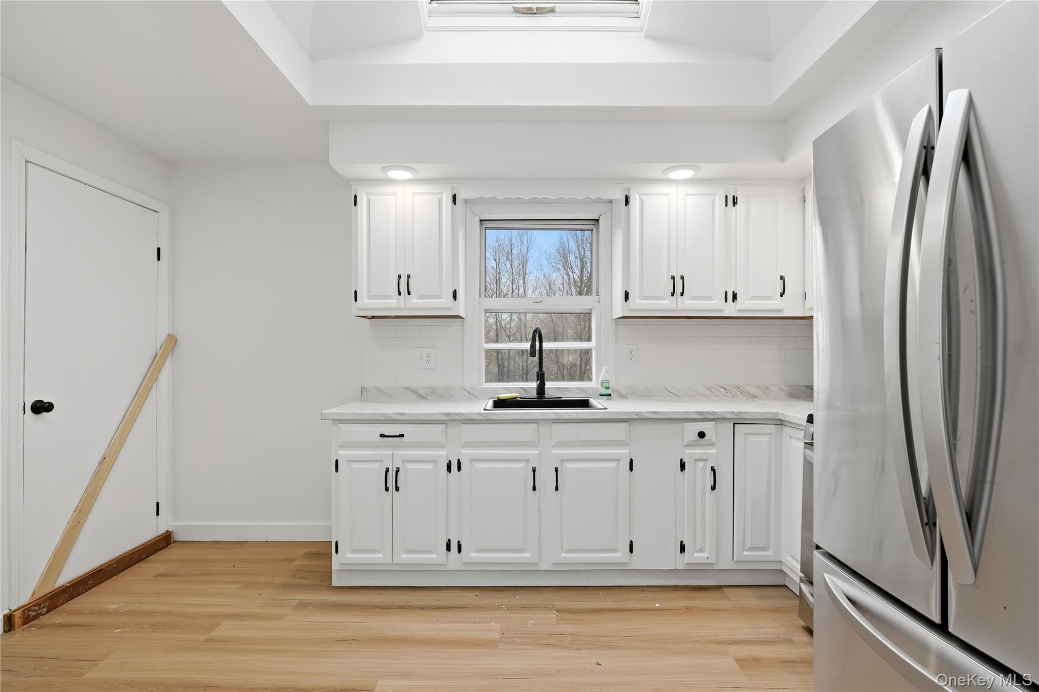 384 Tempaloni Road Ellenville, NY 12428 - Photo 5 of 18 a kitchen with stainless steel appliances granite countertop a refrigerator sink and cabinets