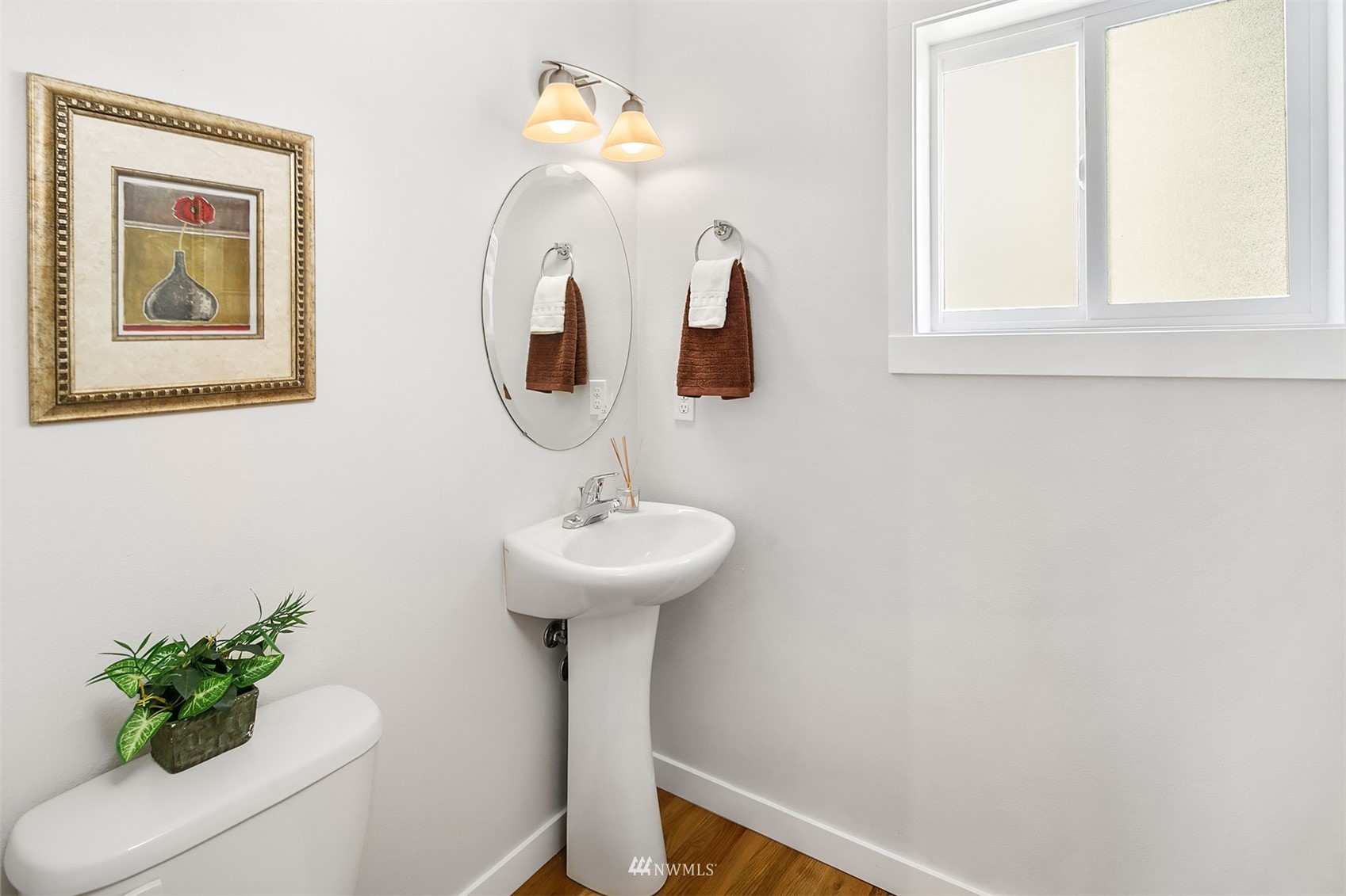 926 North 96th Street Seattle, WA 98103 - Photo 12 of 16 a bathroom with a sink and mirror