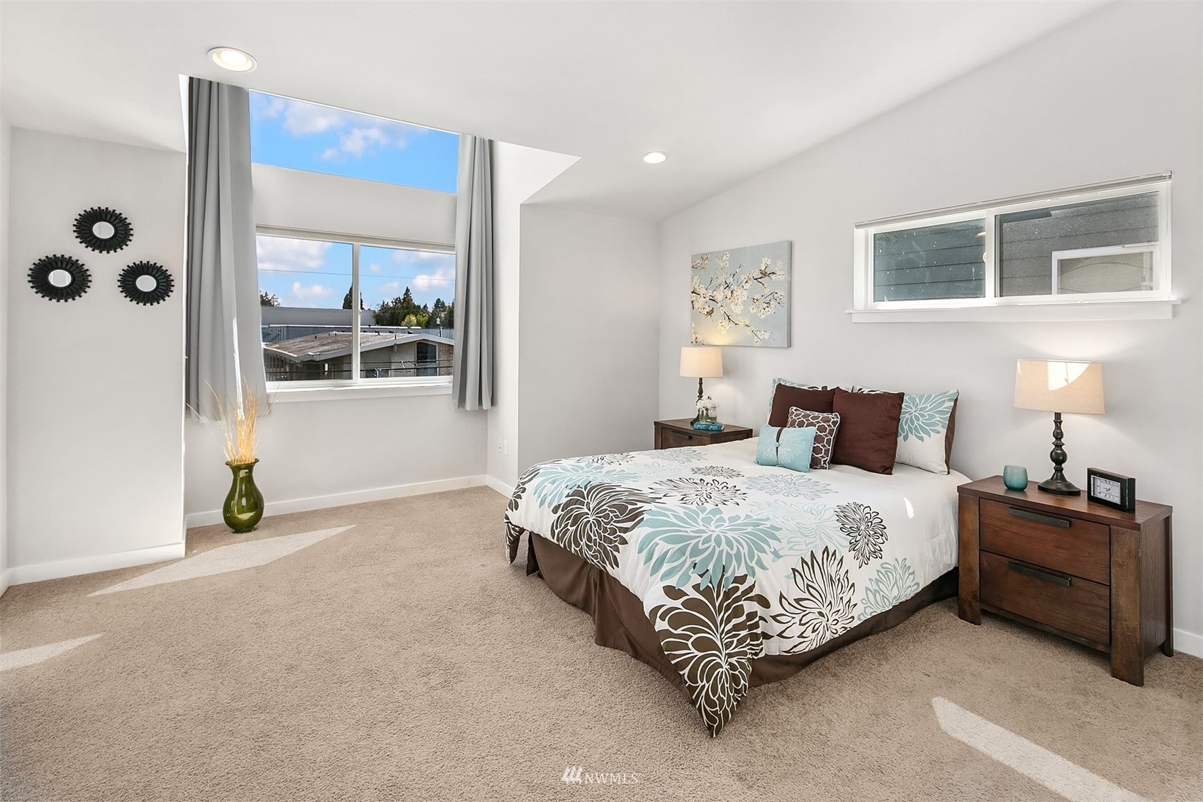 926 North 96th Street Seattle, WA 98103 - Photo 13 of 16 a bedroom with a bed lamp and window