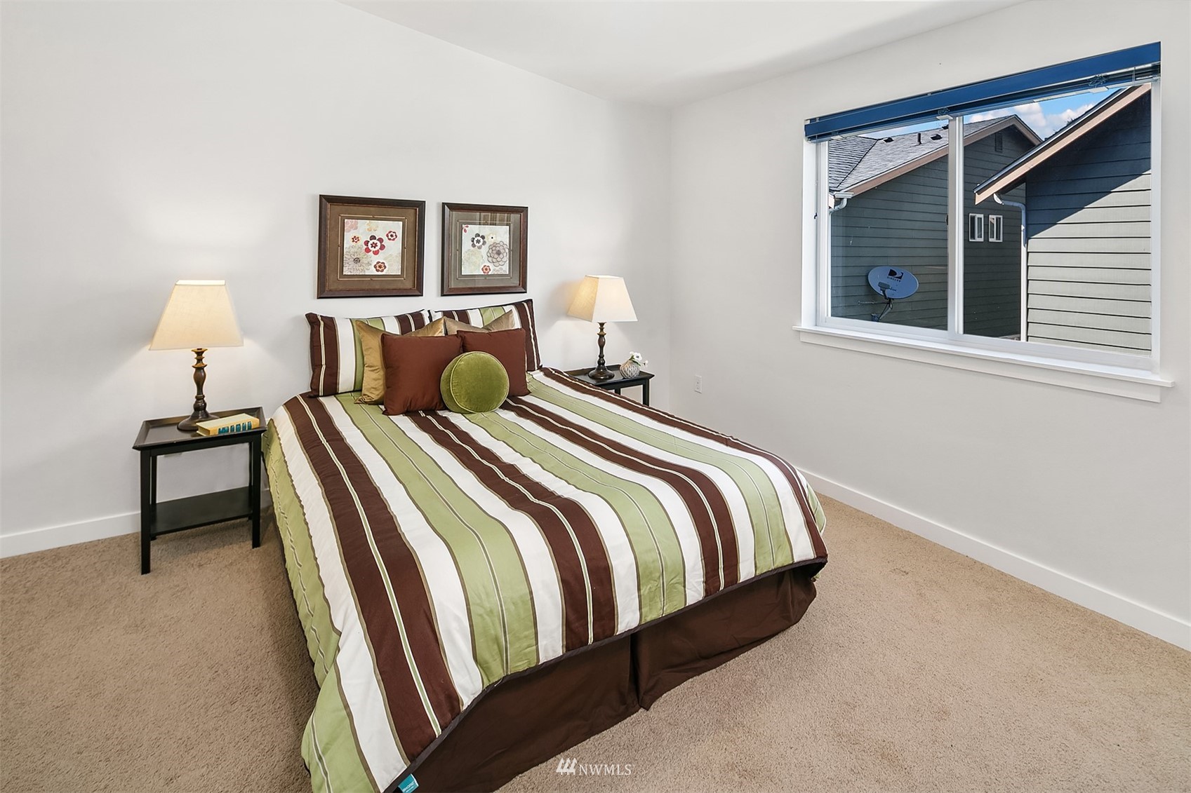926 North 96th Street Seattle, WA 98103 - Photo 15 of 16 a bedroom with a bed and a lamp on table