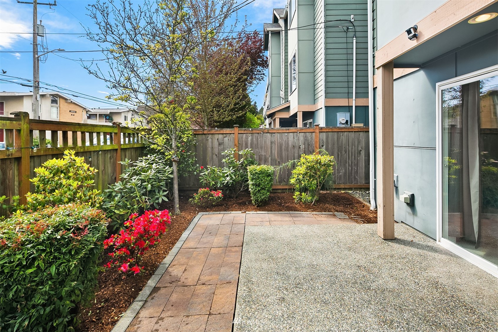 926 North 96th Street Seattle, WA 98103 - Photo 16 of 16 a bunch of flowers in front of main door