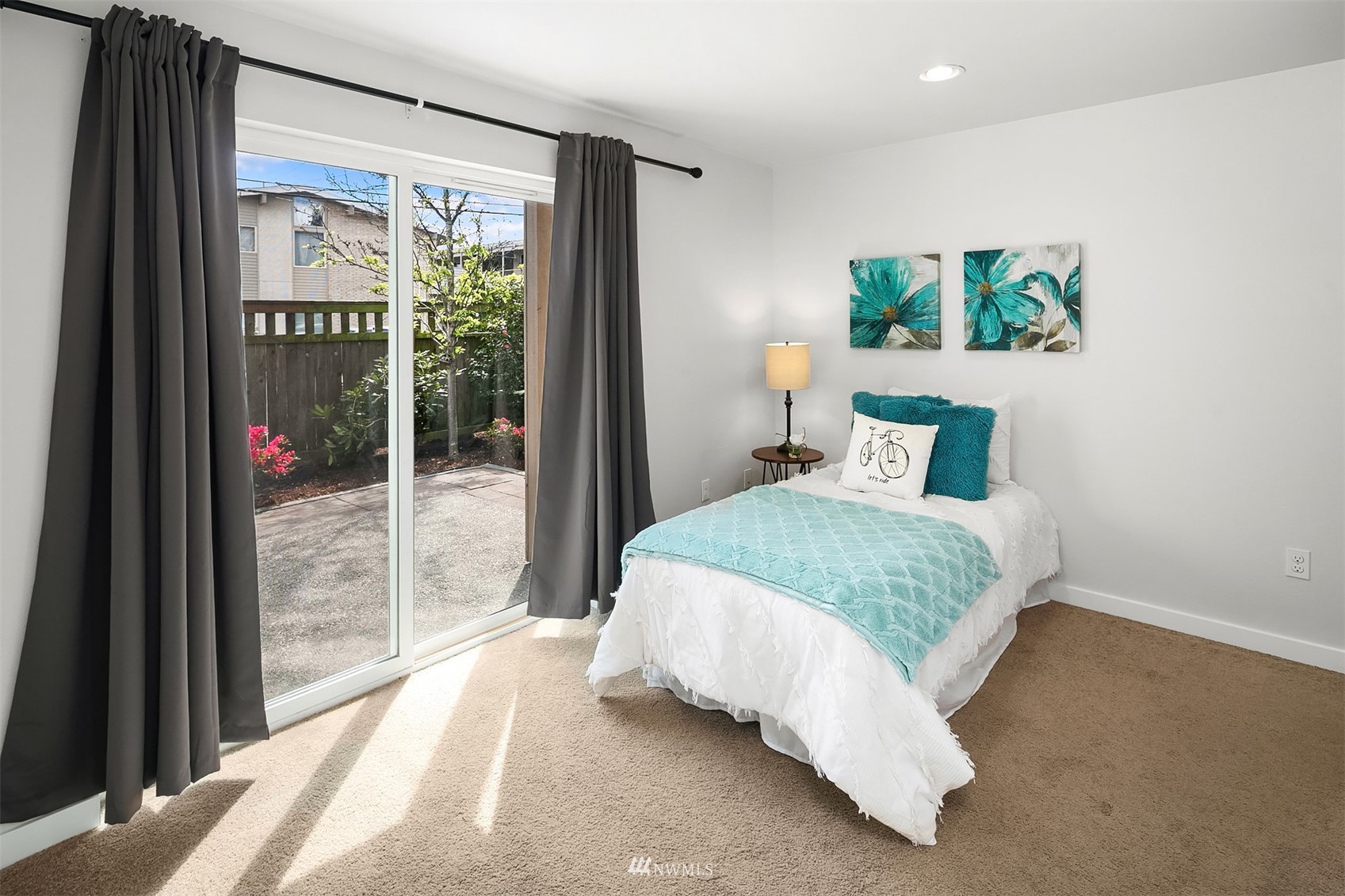 926 North 96th Street Seattle, WA 98103 - Photo 4 of 16 a bedroom with a bed and a large window