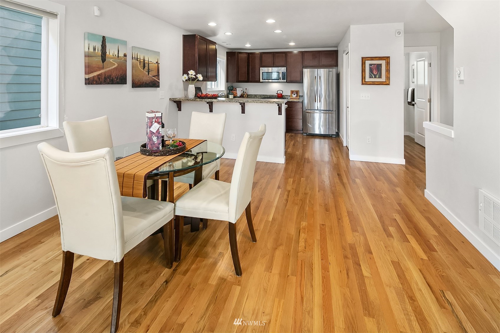 926 North 96th Street Seattle, WA 98103 - Photo 10 of 16 a view of a dining room with furniture and wooden floor