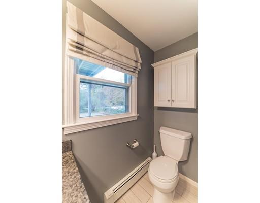 67 Folly Mill Road Salisbury, MA 01952 - Photo 14 of 28 a bathroom with a toilet a sink and a window
