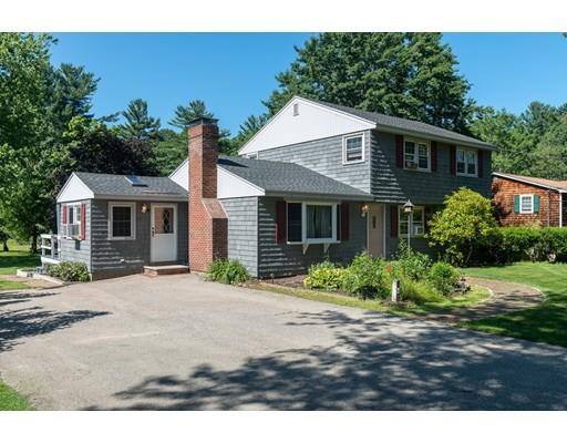 67 Folly Mill Road Salisbury, MA 01952 - Photo 5 of 28 a front view of a house with a yard and potted plants