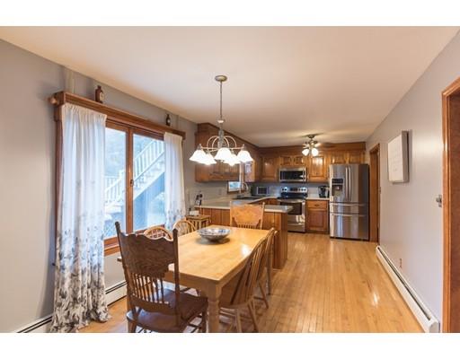 67 Folly Mill Road Salisbury, MA 01952 - Photo 7 of 28 a dining room with a table or chairs and a wooden floor