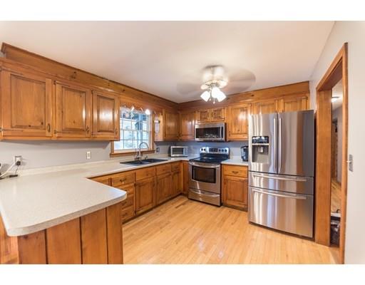 67 Folly Mill Road Salisbury, MA 01952 - Photo 8 of 28 a kitchen with a refrigerator sink and cabinets