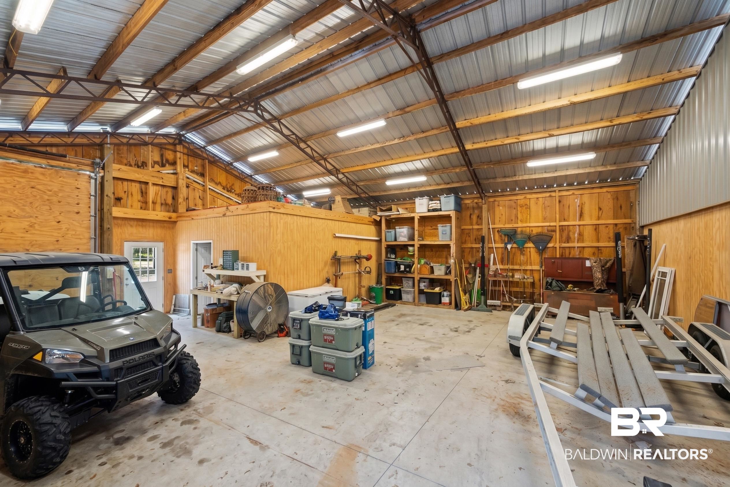 47252 Emmons Road Bay Minette, AL 36507 - Photo 46 of 50 Garage featuring wooden walls