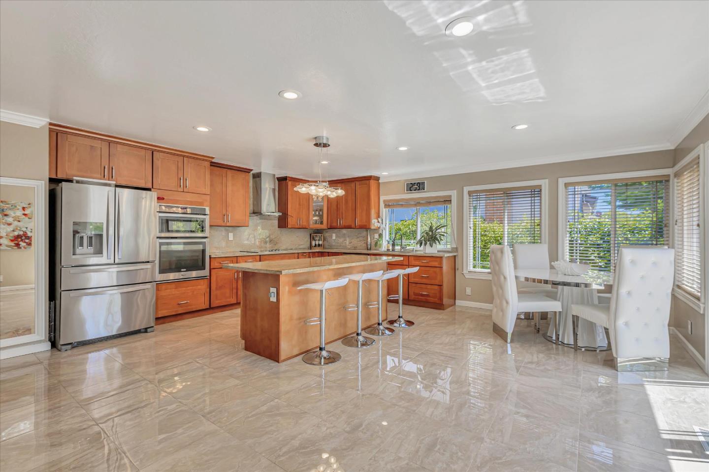 673 Timberpine Avenue Sunnyvale, CA 94086 - Photo 11 of 33 a kitchen with refrigerator and chairs
