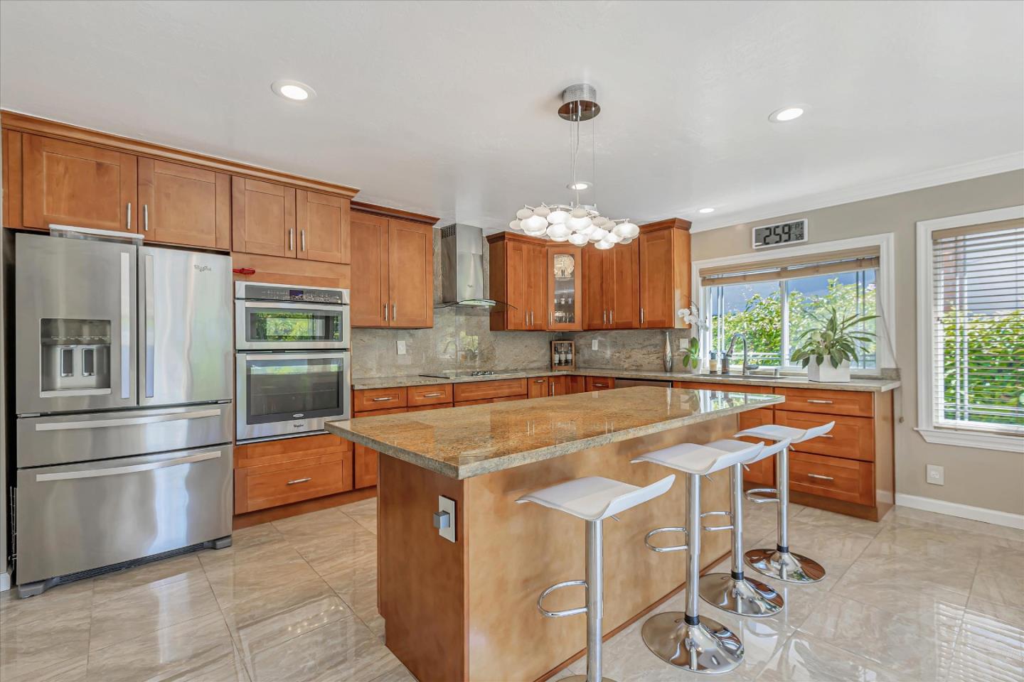 673 Timberpine Avenue Sunnyvale, CA 94086 - Photo 12 of 33 a kitchen with stainless steel appliances granite countertop a sink and a refrigerator