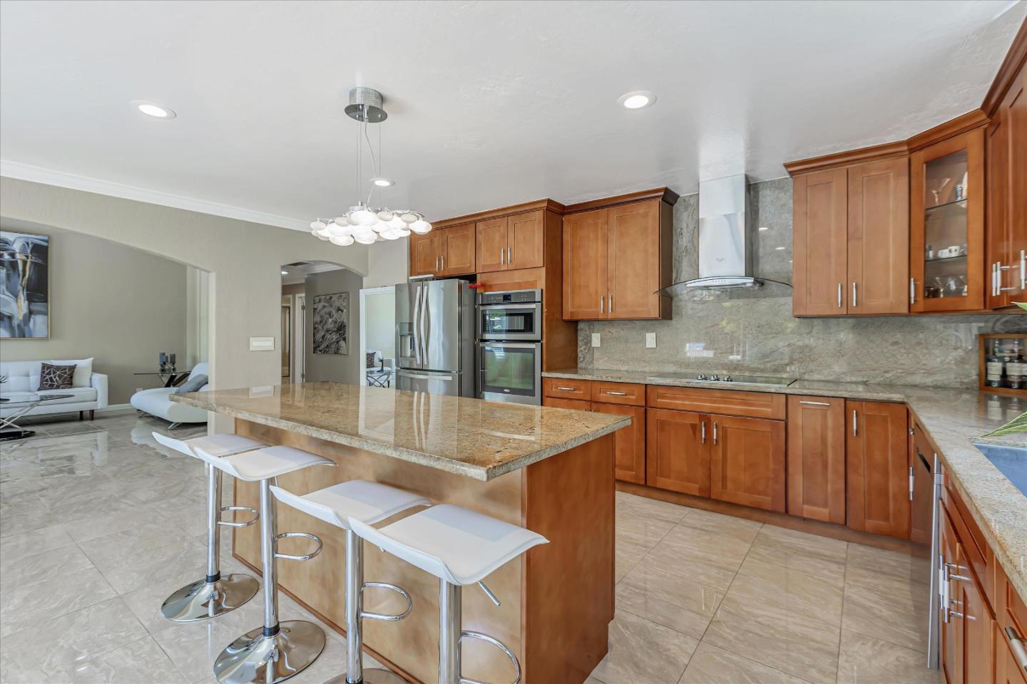 673 Timberpine Avenue Sunnyvale, CA 94086 - Photo 15 of 33 a kitchen with stainless steel appliances granite countertop a sink a stove a refrigerator cabinets and chairs
