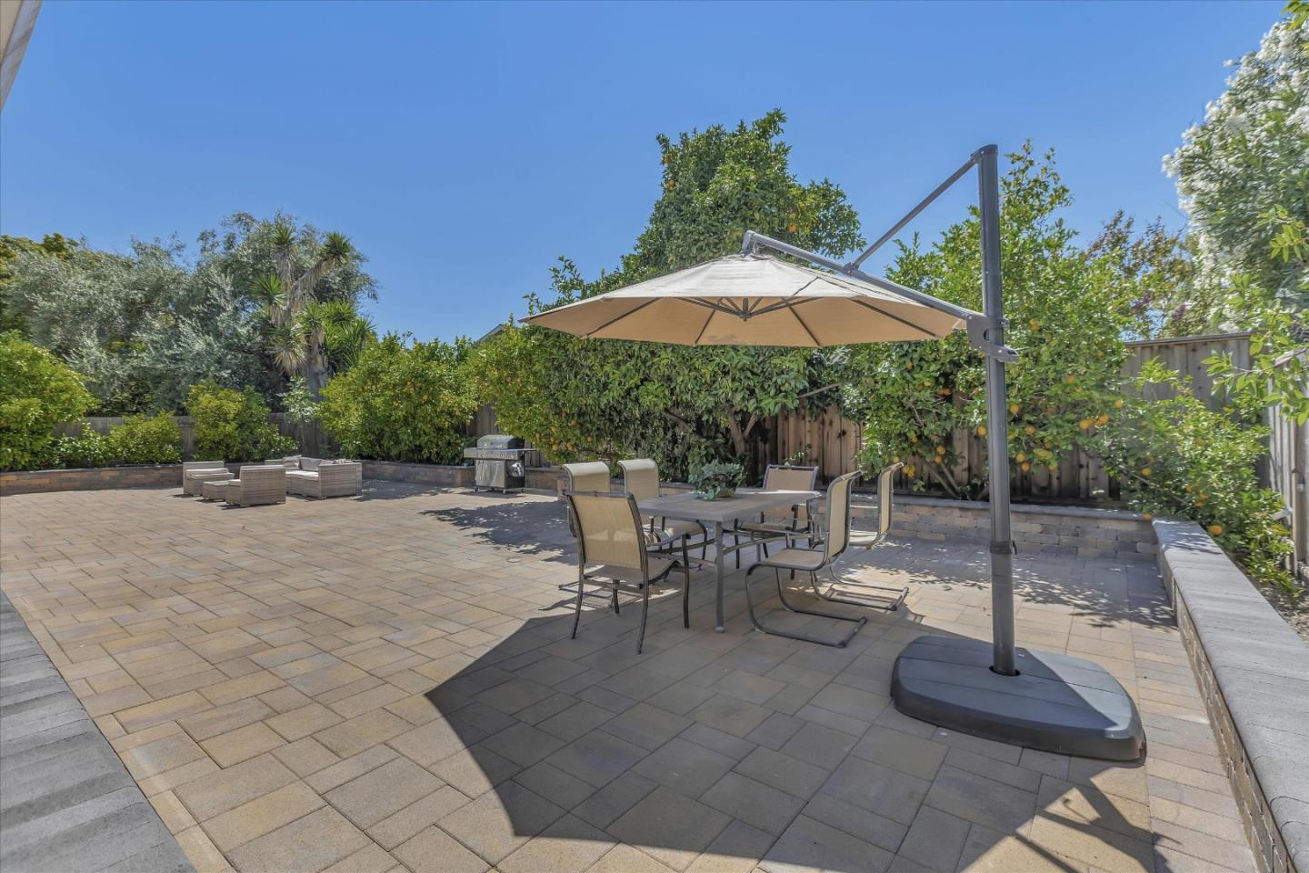 673 Timberpine Avenue Sunnyvale, CA 94086 - Photo 30 of 33 a view of a patio with a table and chairs under an umbrella