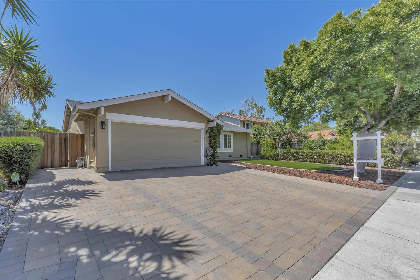 673 Timberpine Avenue Sunnyvale, CA 94086 - Photo 4 of 33 a front view of a house with a yard and garage