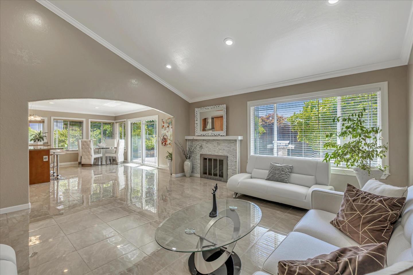 673 Timberpine Avenue Sunnyvale, CA 94086 - Photo 8 of 33 a living room with furniture a large window and a fireplace