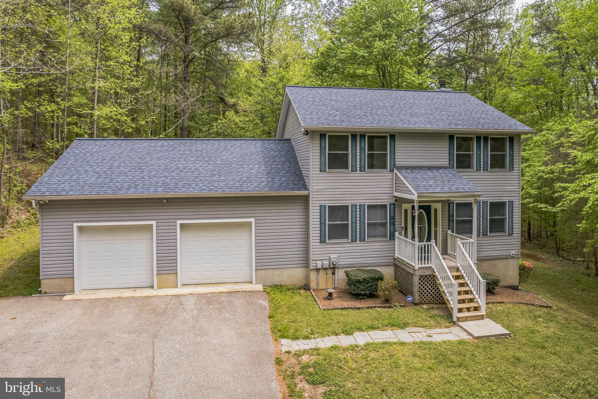 4365 Harvey Road Huntingtown, MD 20639 - Photo 1 of 36 front view of a house with a yard