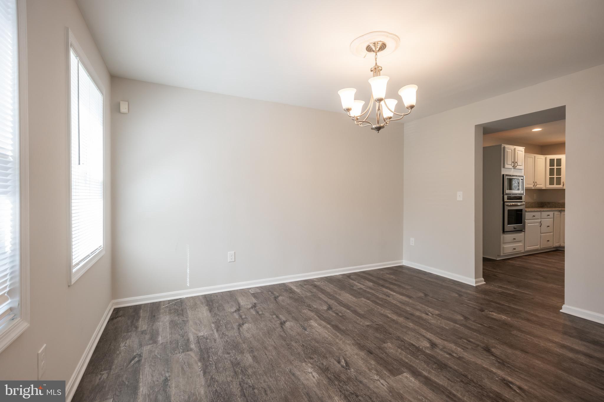 4365 Harvey Road Huntingtown, MD 20639 - Photo 12 of 36 a view of a chandelier in an empty room