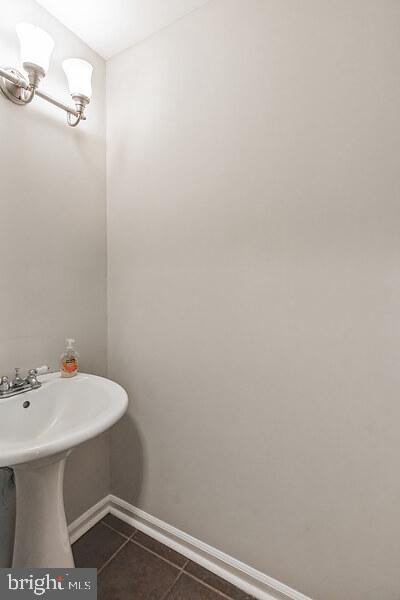 4365 Harvey Road Huntingtown, MD 20639 - Photo 14 of 36 a bathroom with a sink and a mirror