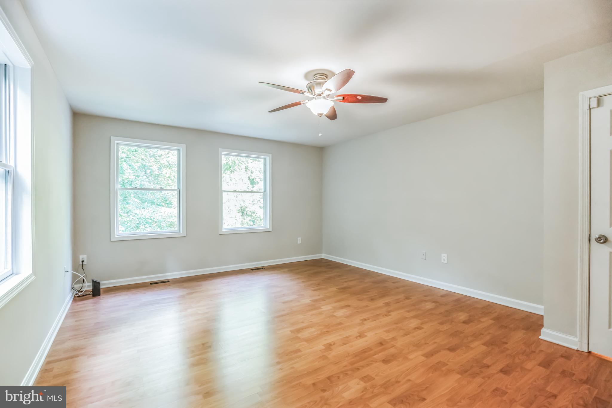 4365 Harvey Road Huntingtown, MD 20639 - Photo 25 of 36 wooden floor in an empty room with a window
