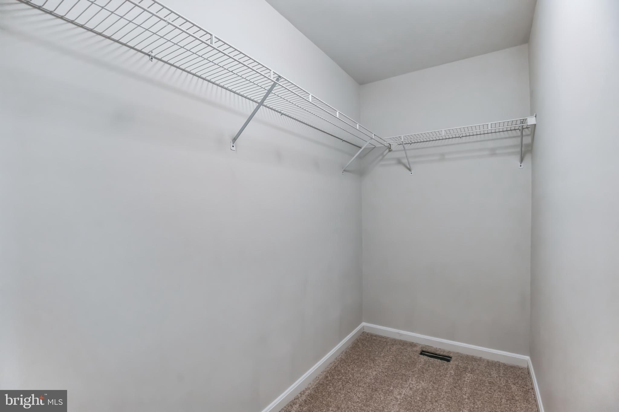 4365 Harvey Road Huntingtown, MD 20639 - Photo 26 of 36 a view of a room with racks on the wall