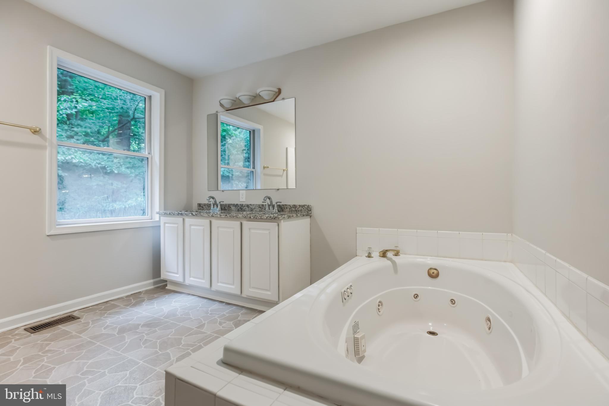 4365 Harvey Road Huntingtown, MD 20639 - Photo 27 of 36 a view of a bathroom with a sink and window