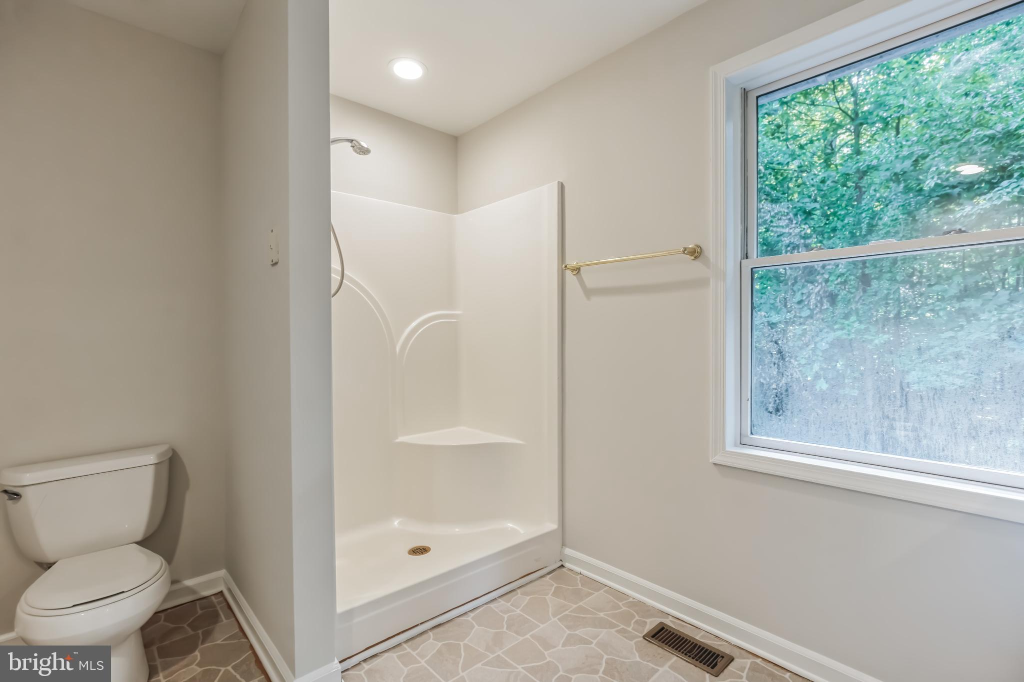 4365 Harvey Road Huntingtown, MD 20639 - Photo 29 of 36 a bathroom with a toilet and a shower