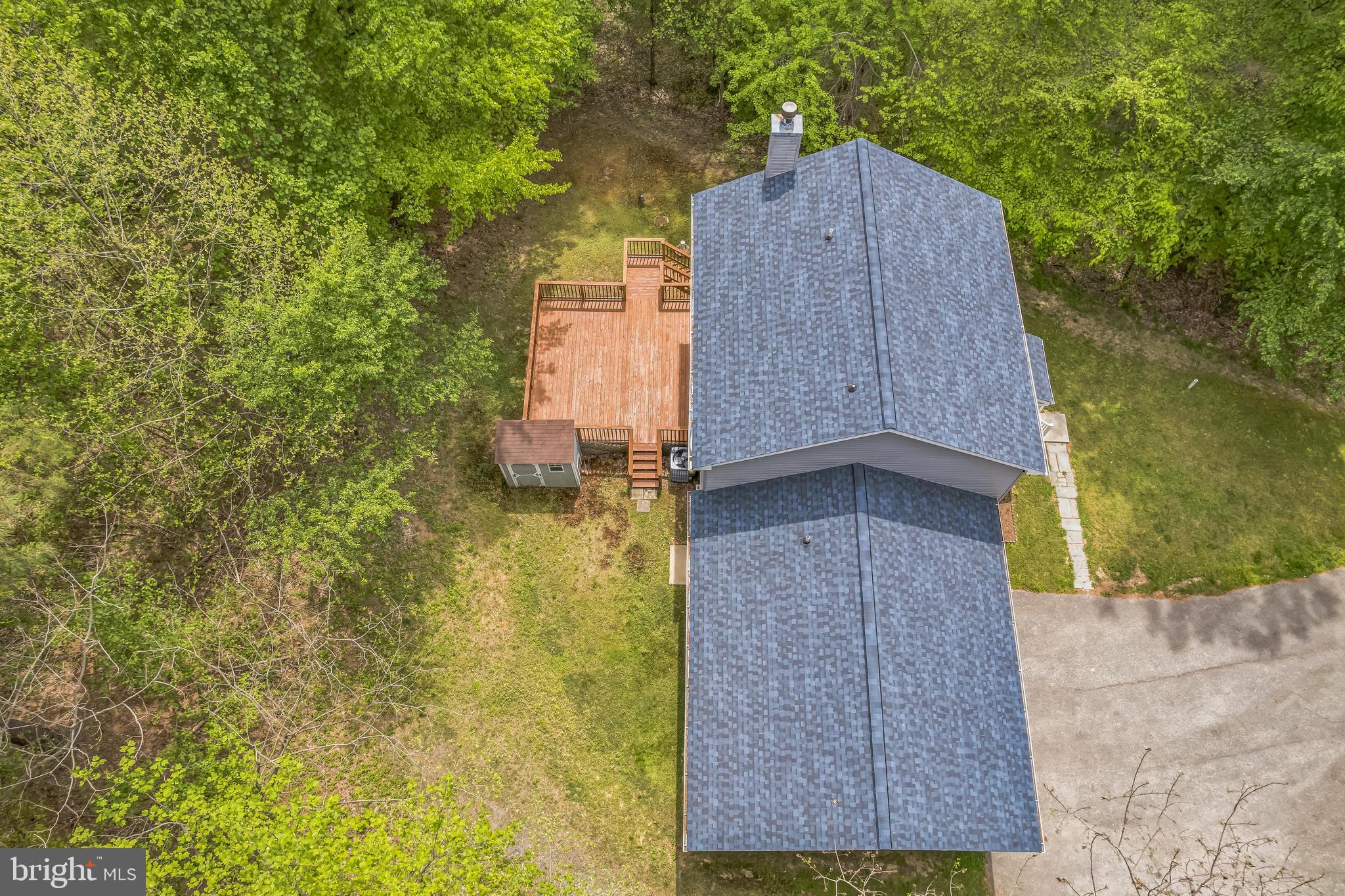 4365 Harvey Road Huntingtown, MD 20639 - Photo 3 of 36 a brick house with a yard