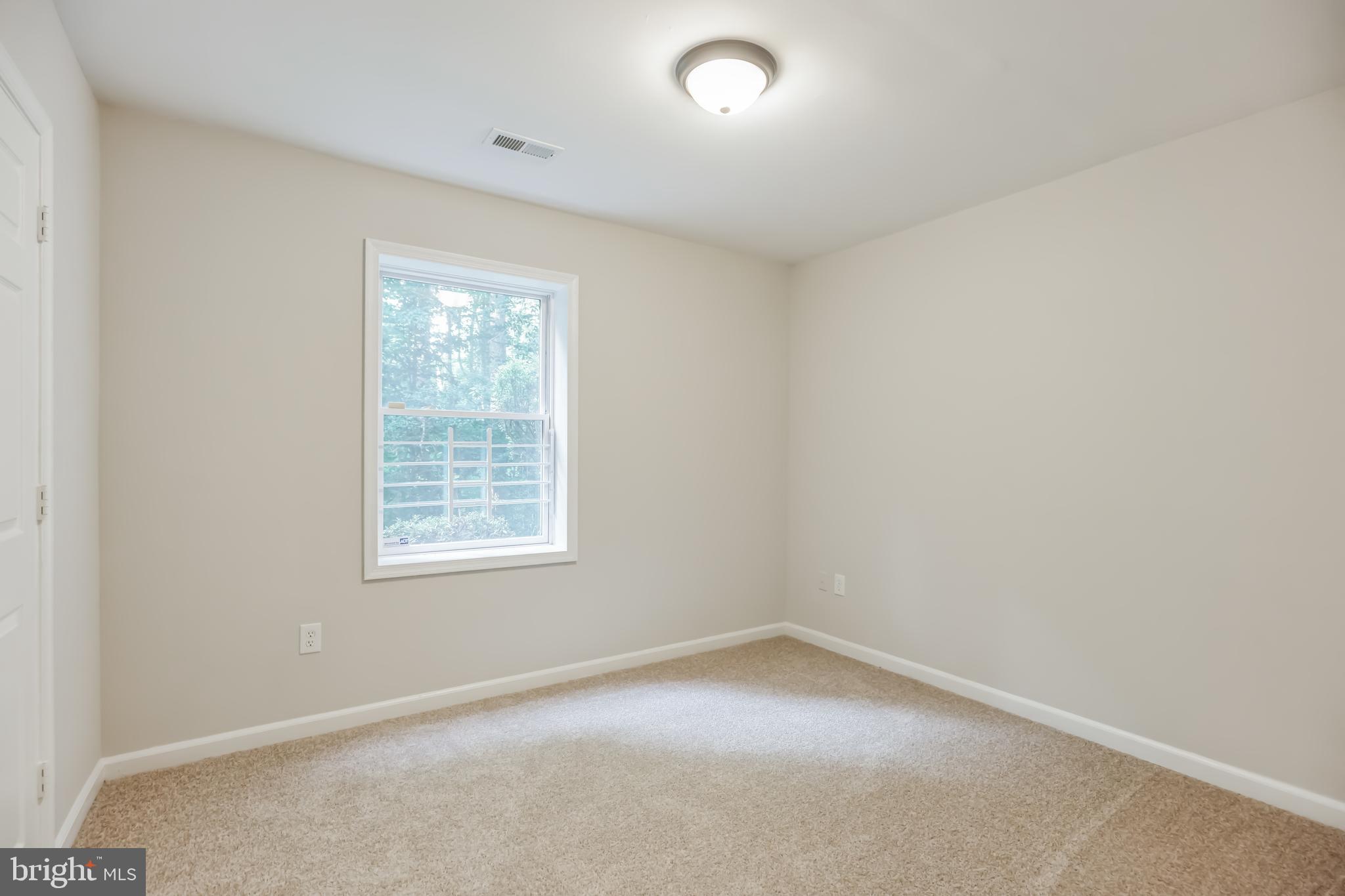 4365 Harvey Road Huntingtown, MD 20639 - Photo 31 of 36 an empty room with a window