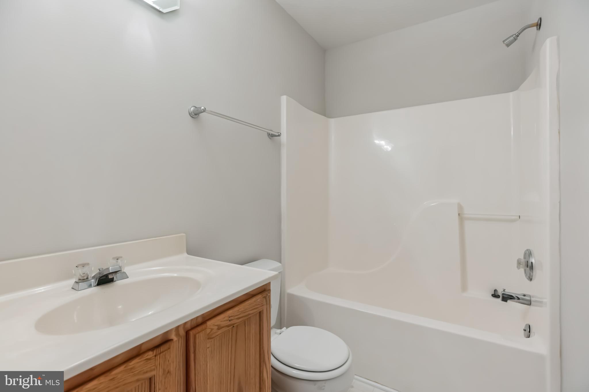 4365 Harvey Road Huntingtown, MD 20639 - Photo 32 of 36 a bathroom with a sink toilet and bathtub