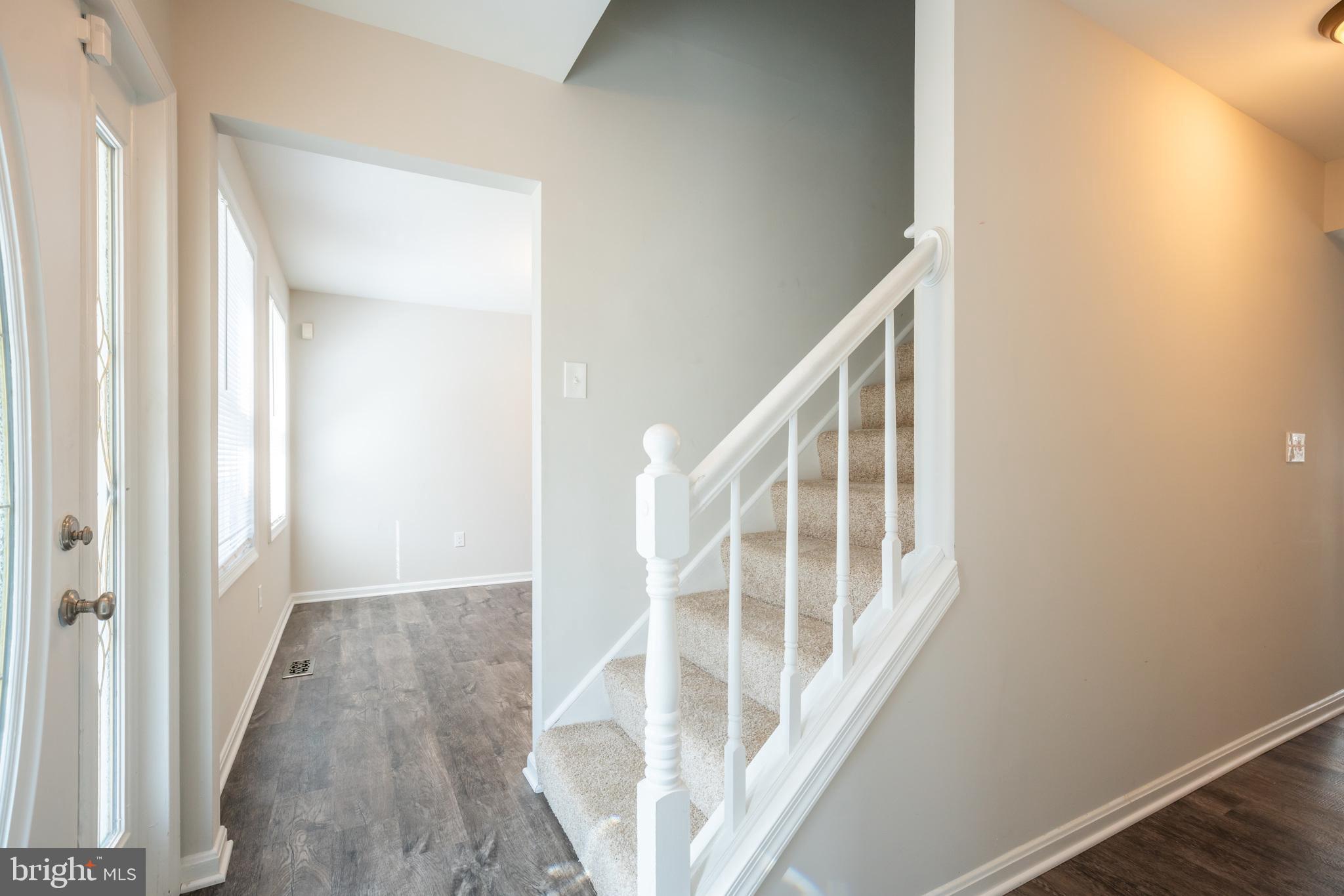 4365 Harvey Road Huntingtown, MD 20639 - Photo 7 of 36 a view of staircase with wooden floor