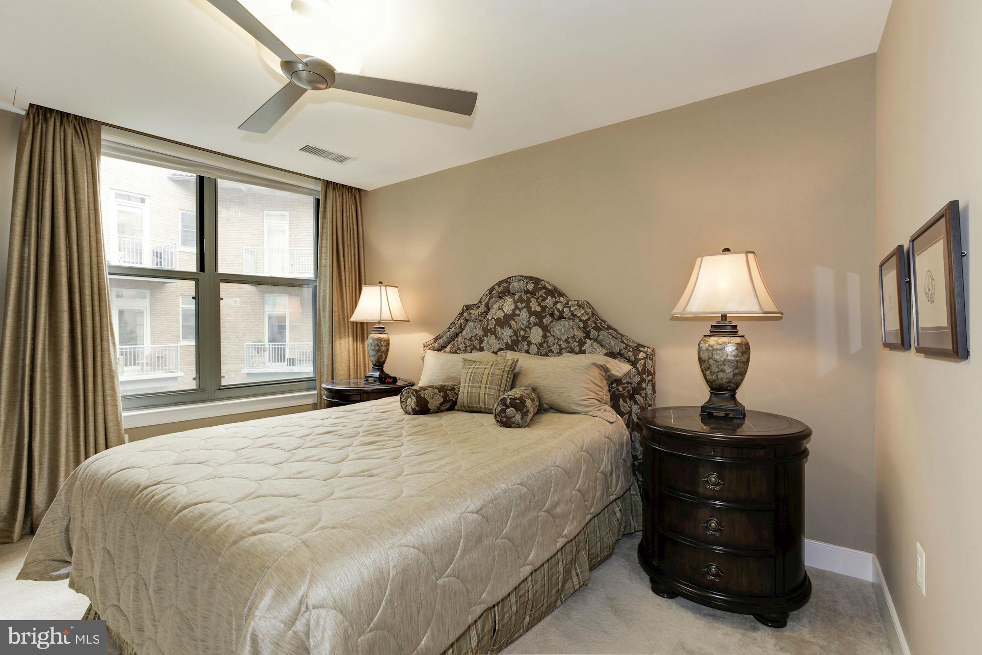 2425 L Street Northwest, Unit 412 Washington, DC 20037 - Photo 13 of 28 a bedroom with a bed and a window