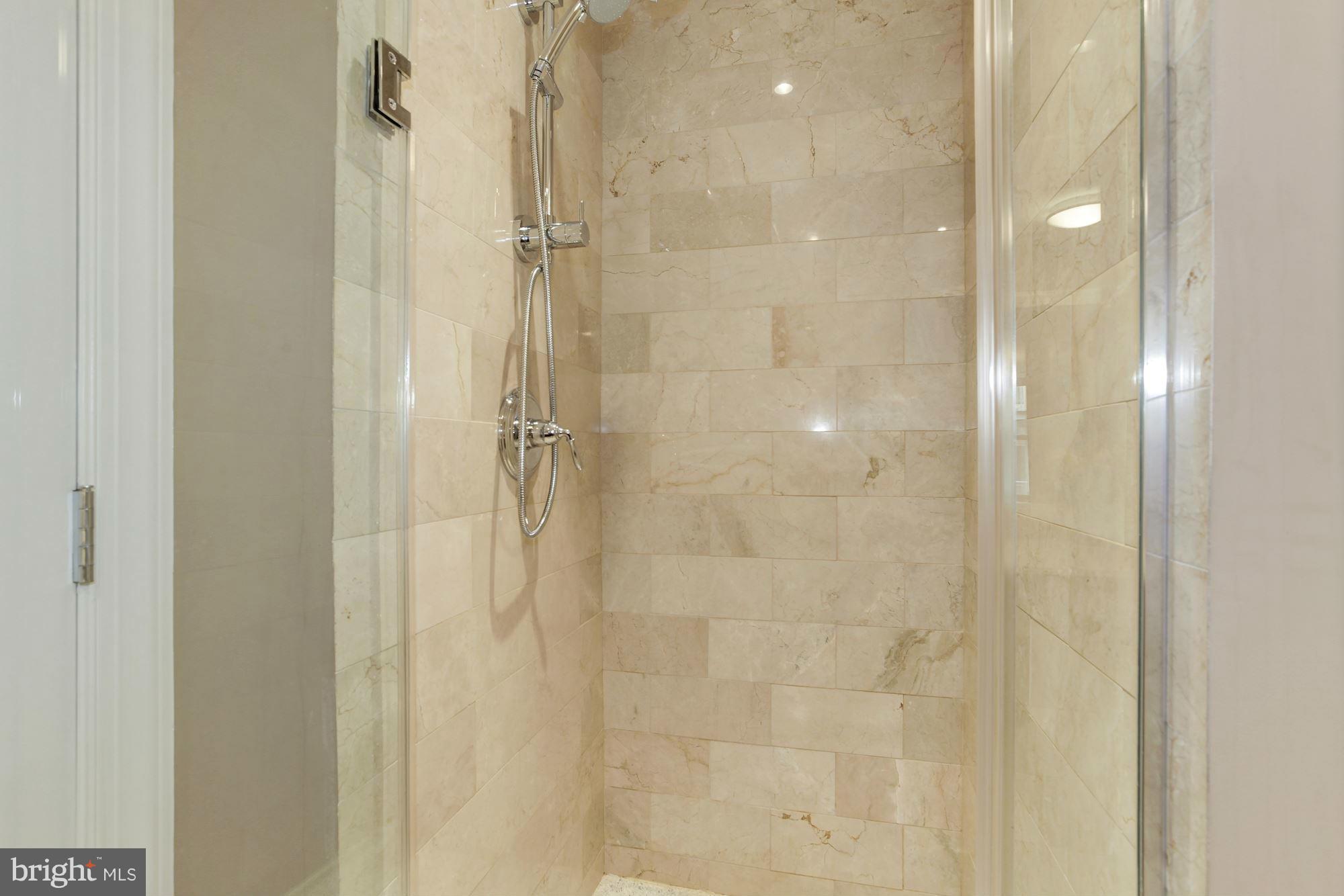 2425 L Street Northwest, Unit 412 Washington, DC 20037 - Photo 16 of 28 a bathroom with a shower