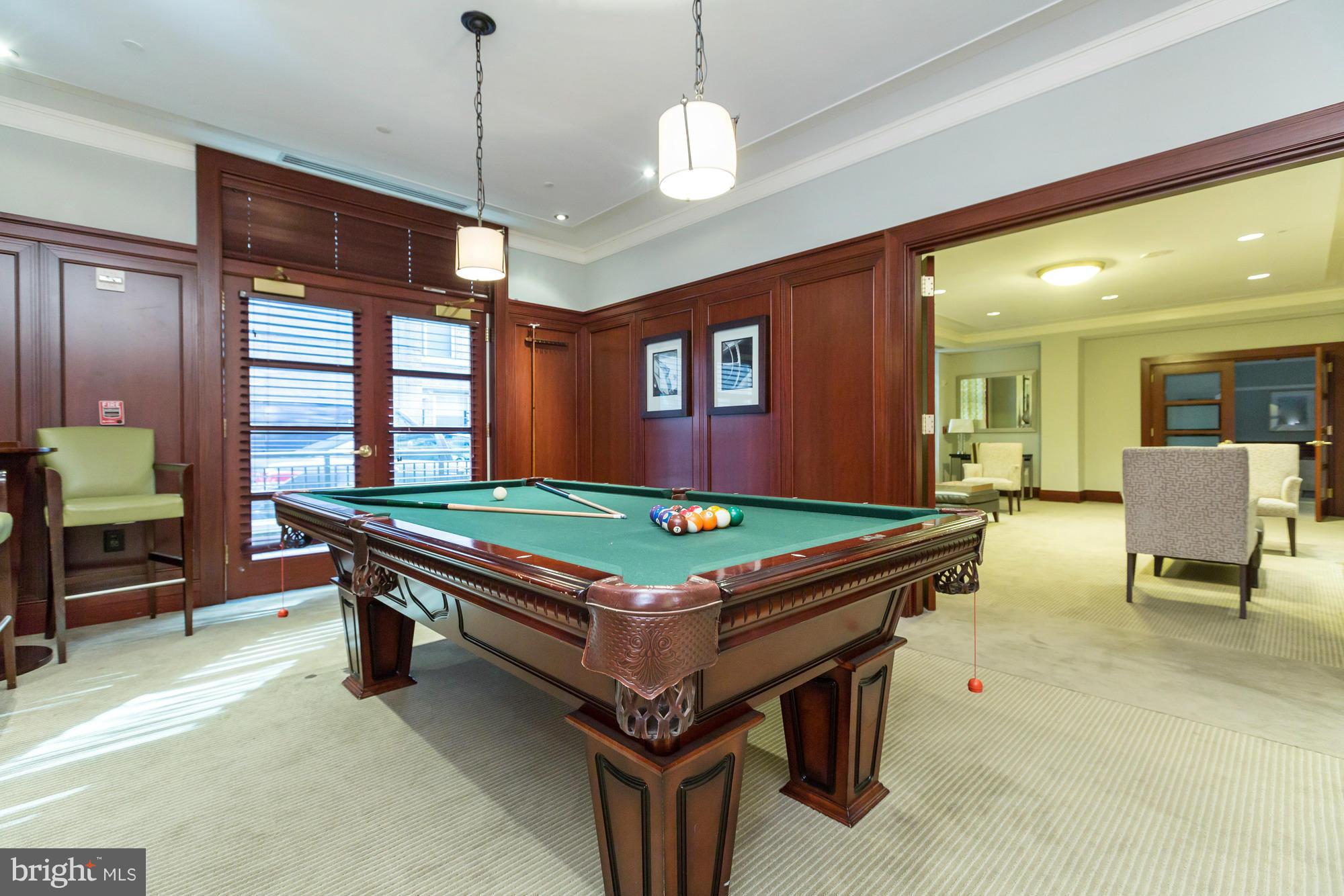 2425 L Street Northwest, Unit 412 Washington, DC 20037 - Photo 23 of 28 a room with pool table and windows