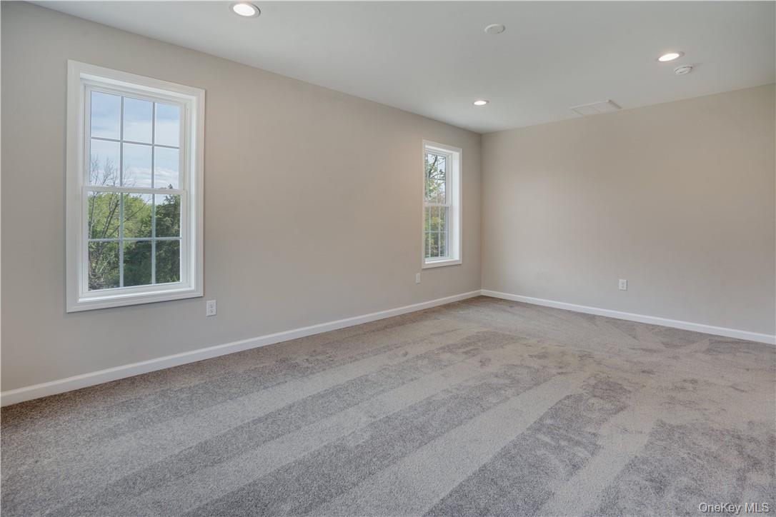 991 Freedom Road Pleasant Valley, NY 12569 - Photo 12 of 23 an empty room with windows
