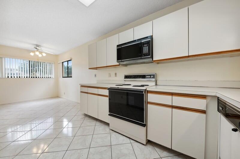 15074 Witney Road, Unit C101 Delray Beach, FL 33484 - Photo 8 of 25 08_15074WitneyRd_Unit101_191001_KitchenB