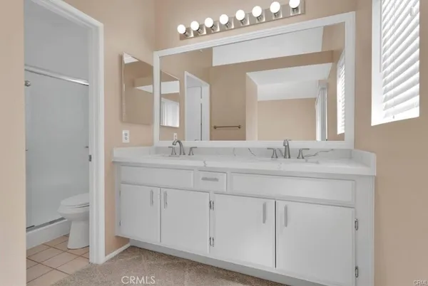 a balcony with table and chairs