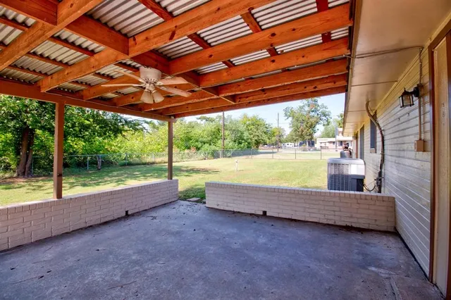 a view of patio with swimming pool