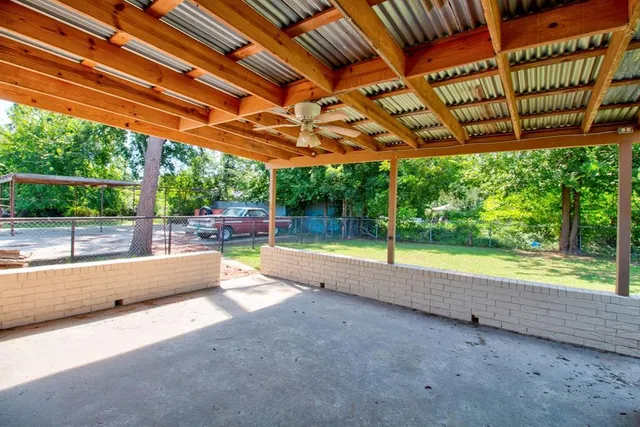 a view of swimming pool with a patio