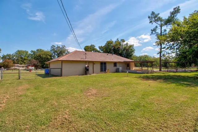 a front view of house with outdoor space and garden