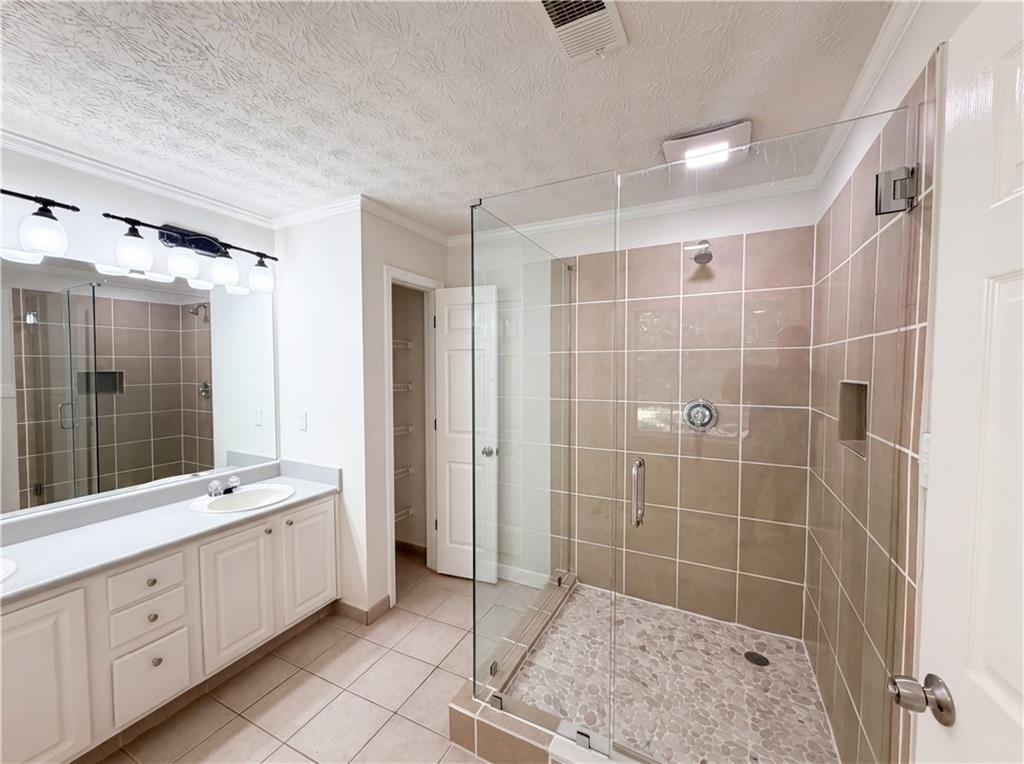 722 Ridgetop Road Bethlehem, GA 30620 - Photo 17 of 23 a bathroom with a double vanity sink toilet and shower