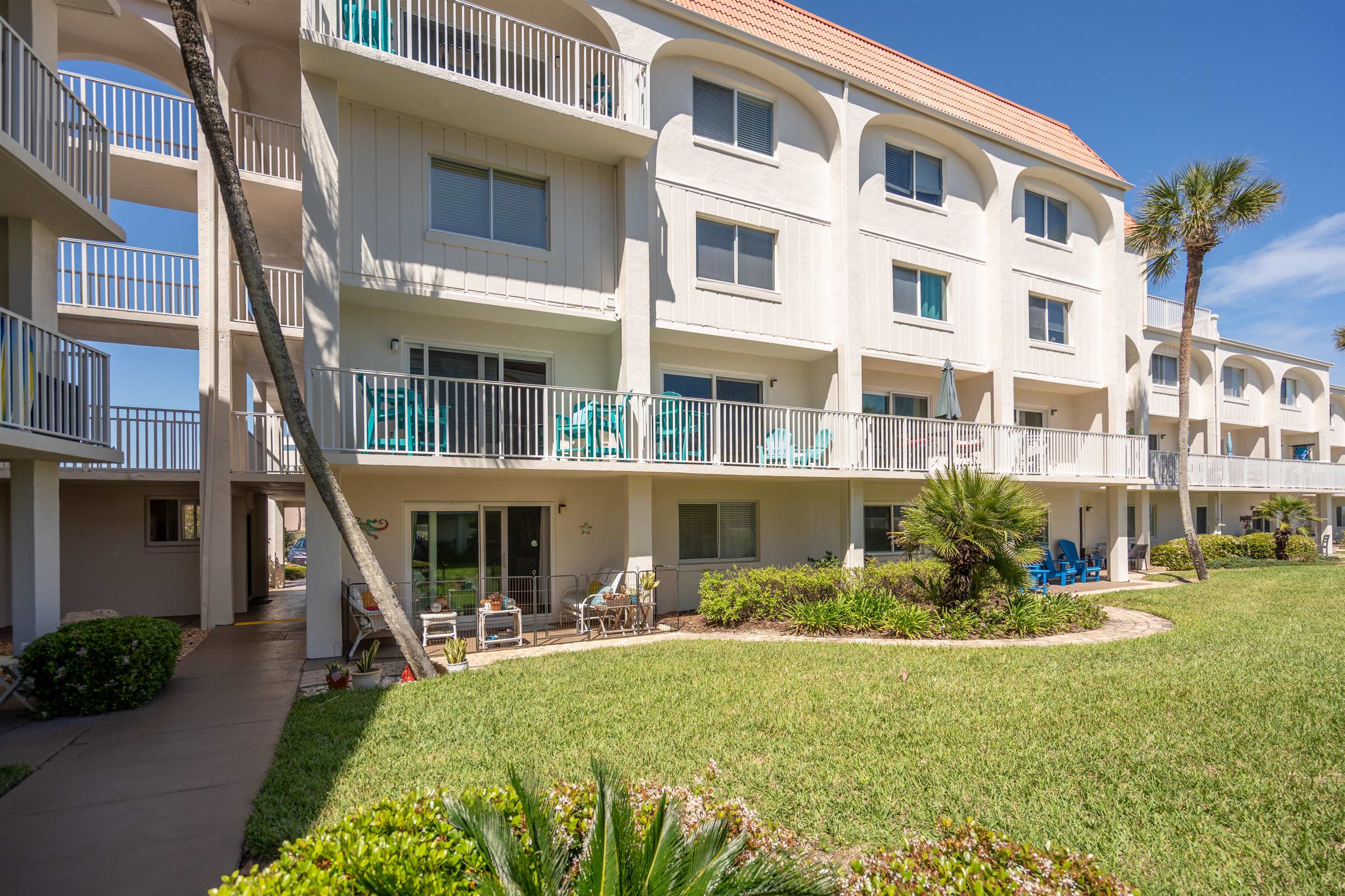 1 Ocean Trace Road, Unit 232 St. Augustine, FL 32080 - Photo 23 of 49 a view of a building with a yard