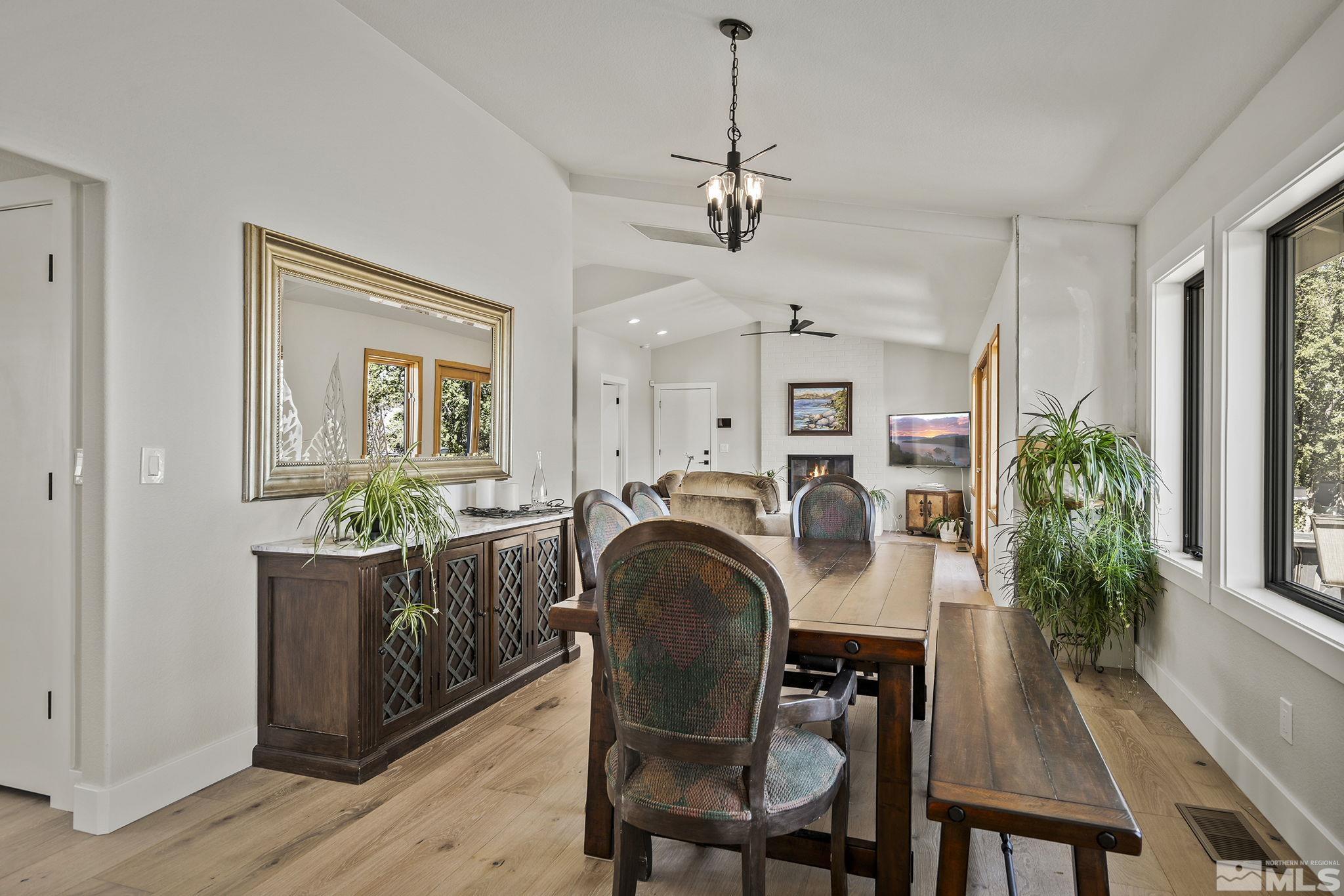 13285 Welcome Way Reno, NV 89511 - Photo 13 of 38 a view of a dining room with furniture window and wooden floor