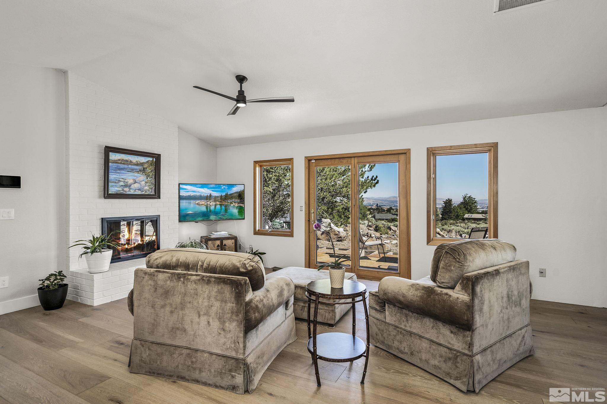 13285 Welcome Way Reno, NV 89511 - Photo 16 of 38 a living room with furniture and a large window