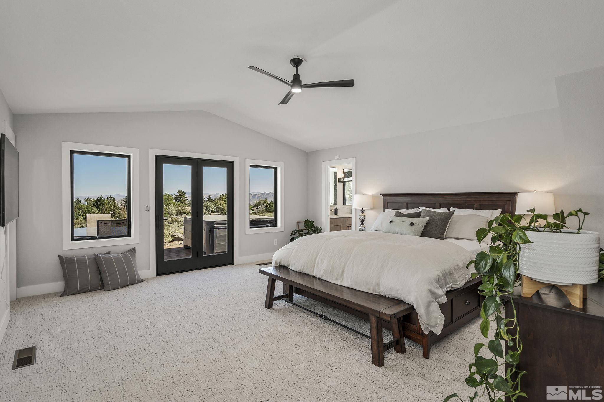 13285 Welcome Way Reno, NV 89511 - Photo 18 of 38 a spacious bedroom with a bed and window