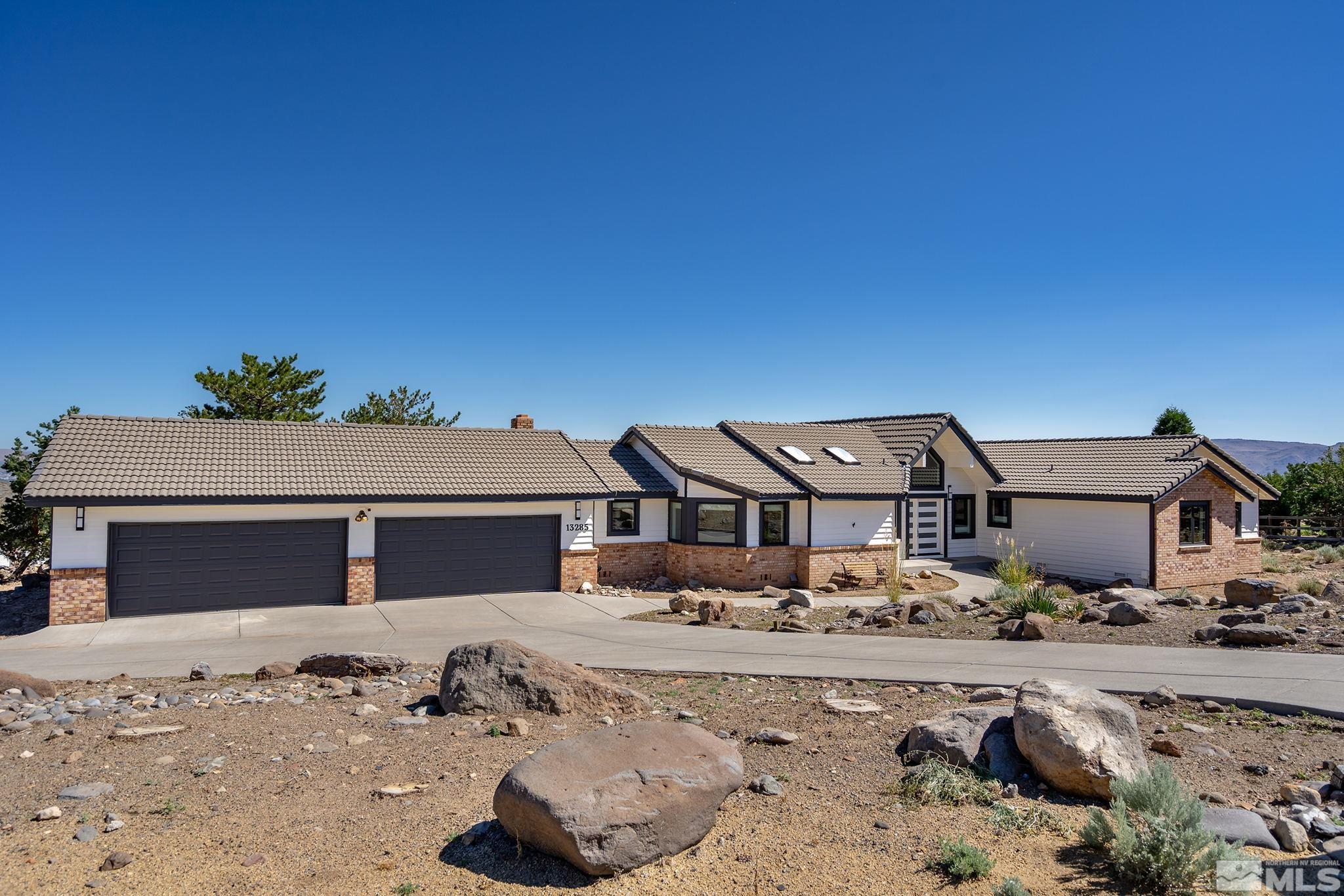 13285 Welcome Way Reno, NV 89511 - Photo 2 of 38 front view of a house with a yard