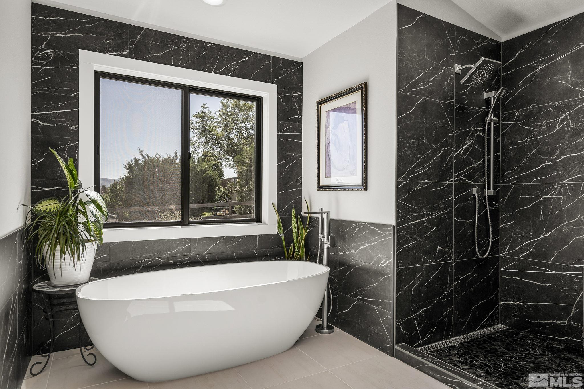 13285 Welcome Way Reno, NV 89511 - Photo 21 of 38 a white bath tub sitting in front of a window