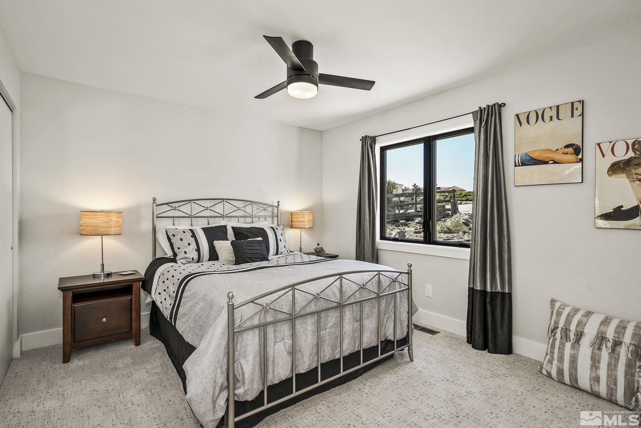 13285 Welcome Way Reno, NV 89511 - Photo 23 of 38 a bedroom with a bed and a window
