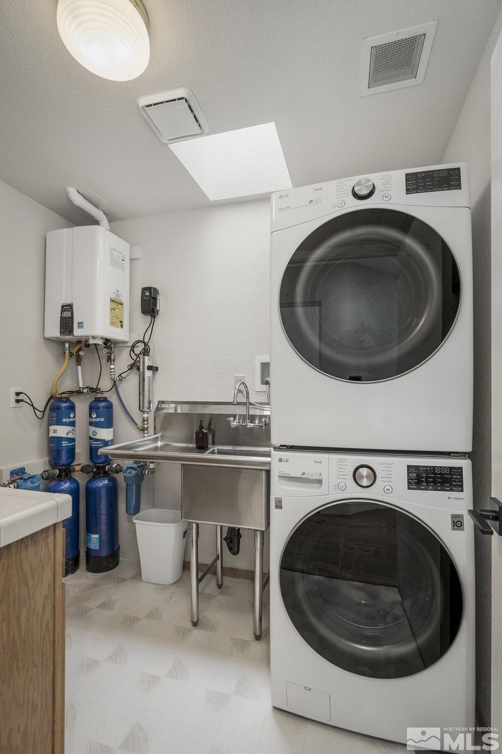 13285 Welcome Way Reno, NV 89511 - Photo 28 of 38 a utility room with sink dryer and washer